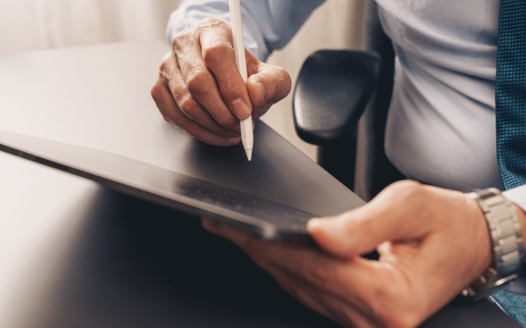 Digital signature on tablet with stylus for business documents