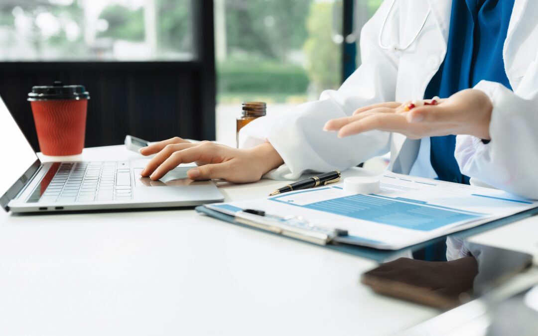 Doctor working on tablet electronics chiropractic EHR systems