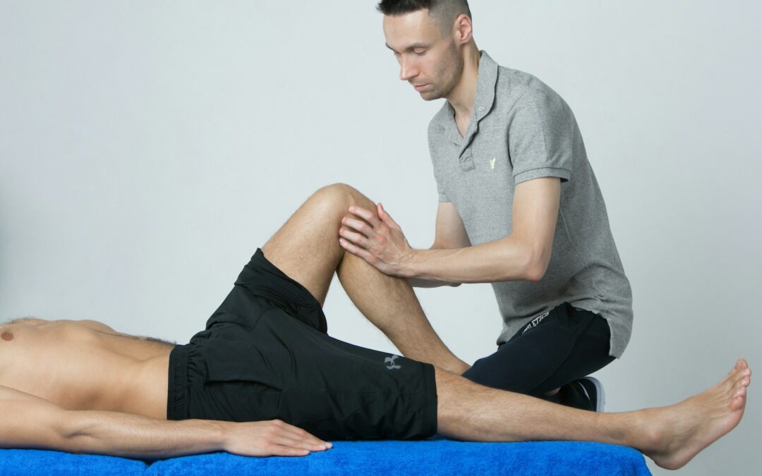 a man getting his leg examined by a chiropractor
